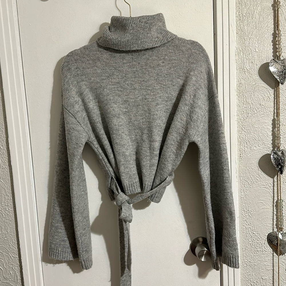 Gray Forever 21 backless wrap turtleneck sweater.